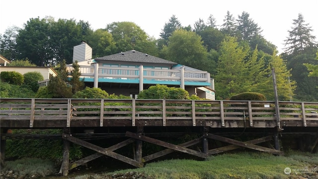 rear view of house with a wooden deck