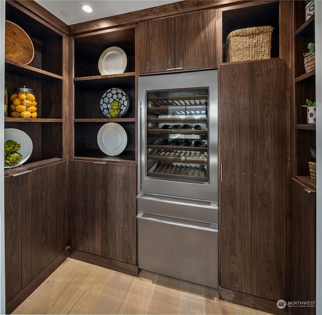 interior space with light wood-type flooring and wine cooler