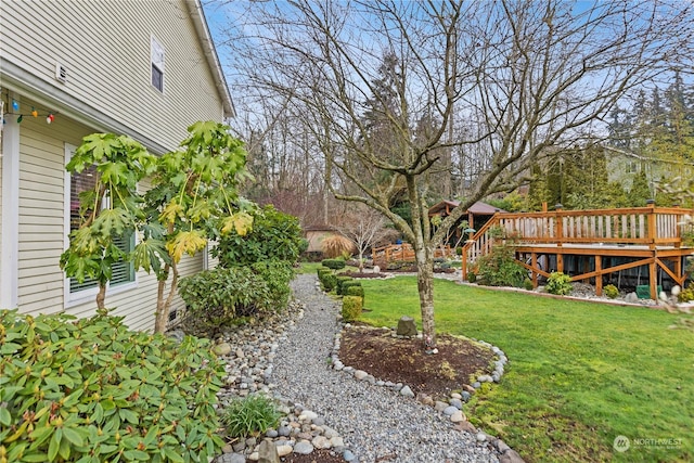 view of yard with a wooden deck