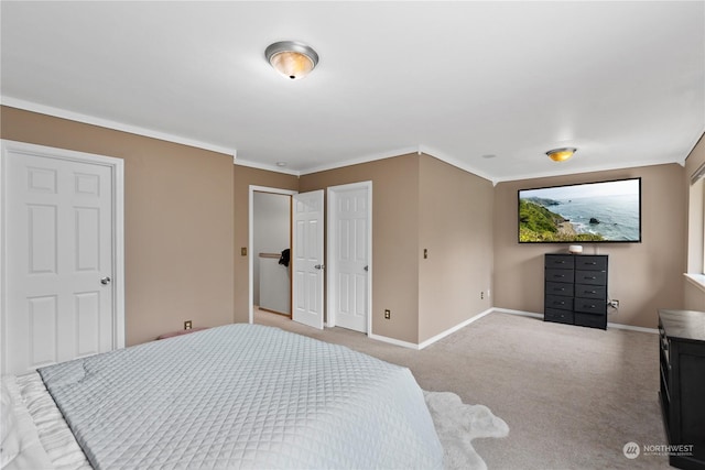 carpeted bedroom with ornamental molding