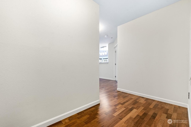 hall with dark wood-type flooring