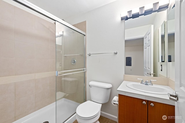 bathroom with vanity, toilet, and an enclosed shower