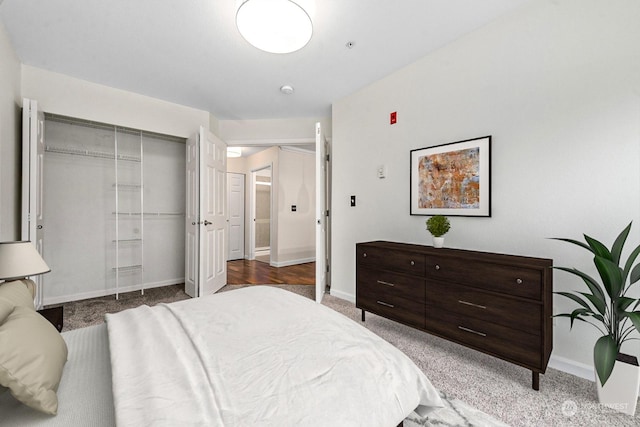 carpeted bedroom with a closet