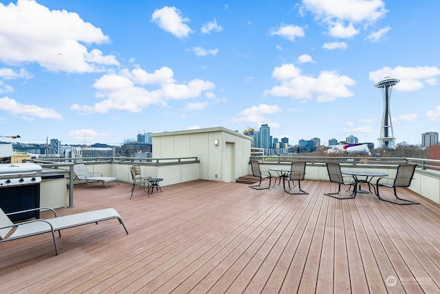 wooden terrace with area for grilling