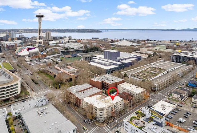 birds eye view of property with a water view