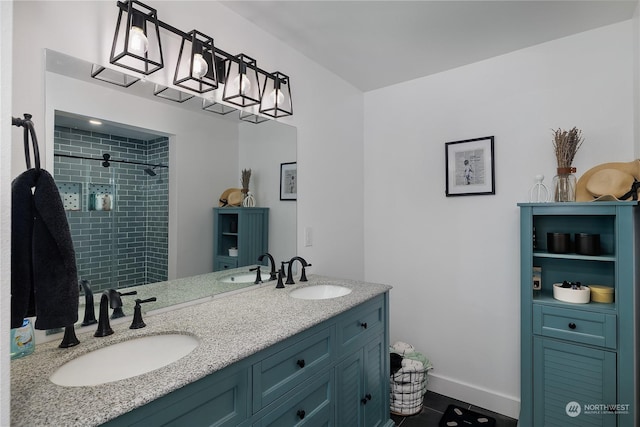 bathroom featuring vanity and tiled shower