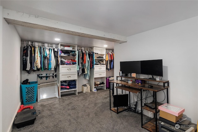 home office with beamed ceiling and dark colored carpet