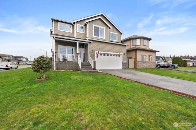 view of front of home with an attached garage, covered porch, concrete driveway, board and batten siding, and a front yard