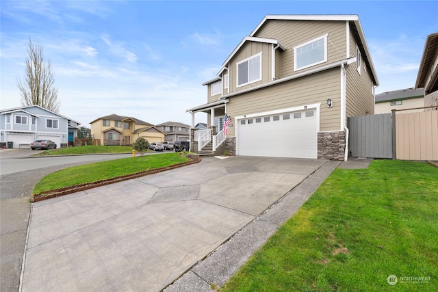 view of front of home with a front lawn and a garage