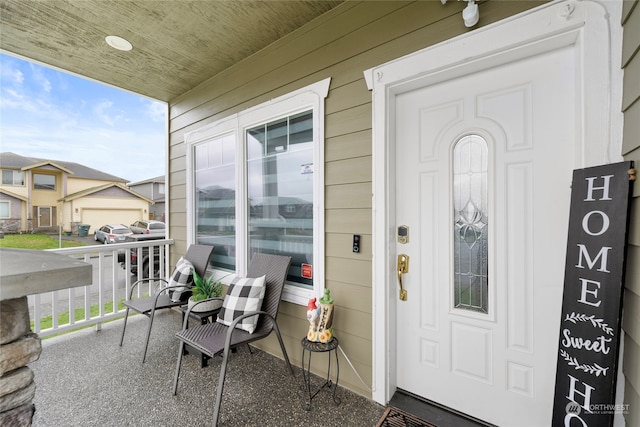 view of exterior entry with covered porch