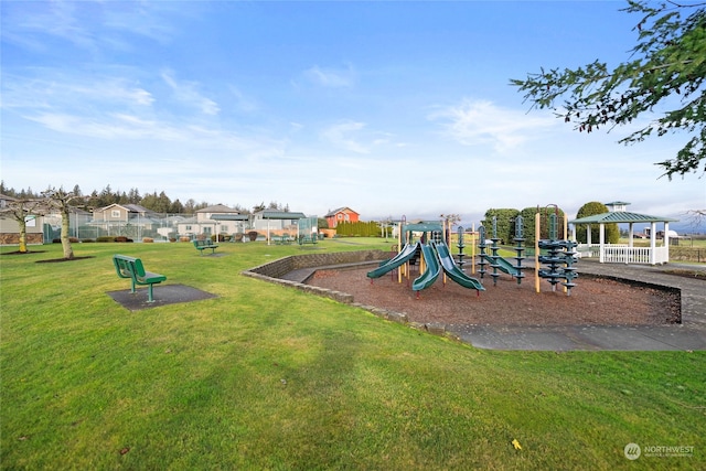 view of jungle gym with a gazebo and a lawn