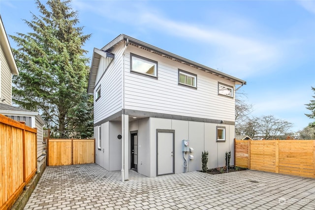 back of house with a patio area