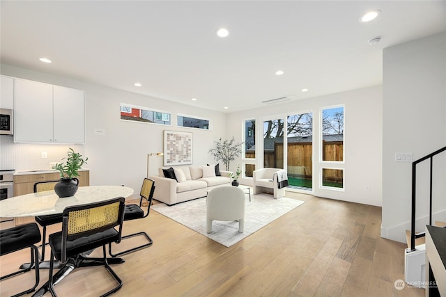 living room with light hardwood / wood-style flooring