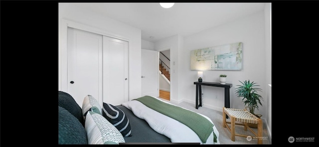 carpeted bedroom featuring a closet