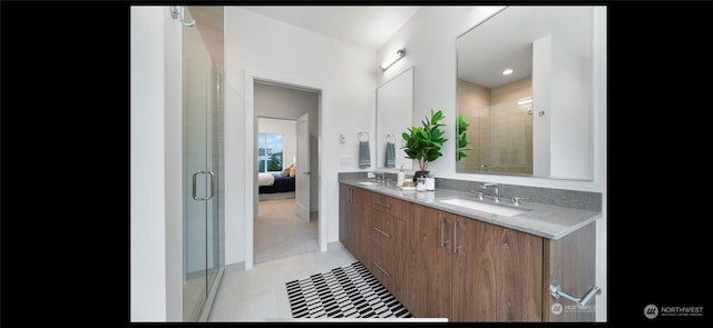 bathroom featuring tile patterned flooring and vanity