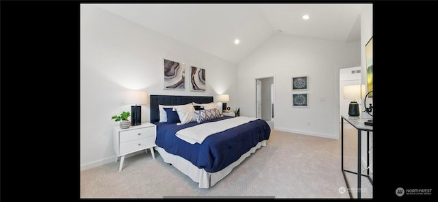 bedroom with lofted ceiling and light colored carpet