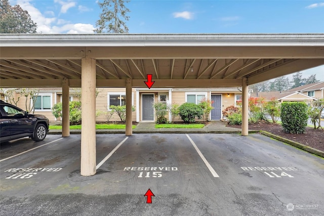 view of parking / parking lot with a carport