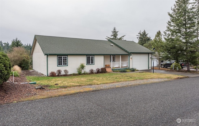 ranch-style house with a front yard, a porch, and a garage