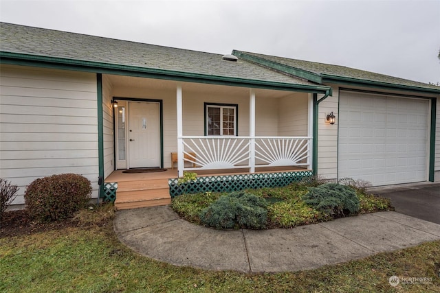 view of front of house with covered porch and a garage