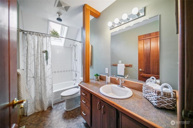 full bathroom featuring a skylight, shower / tub combo with curtain, vanity, and toilet