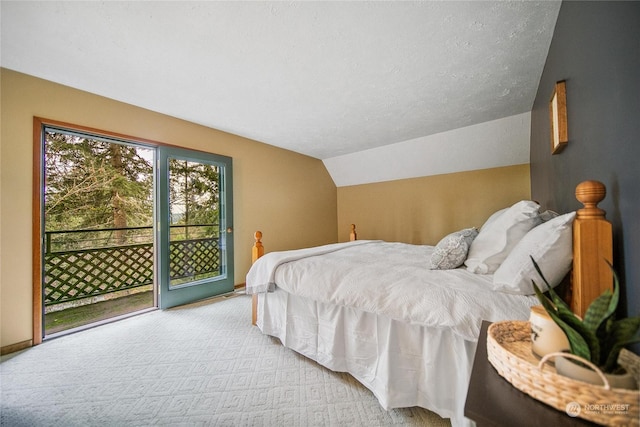 carpeted bedroom featuring access to exterior and vaulted ceiling