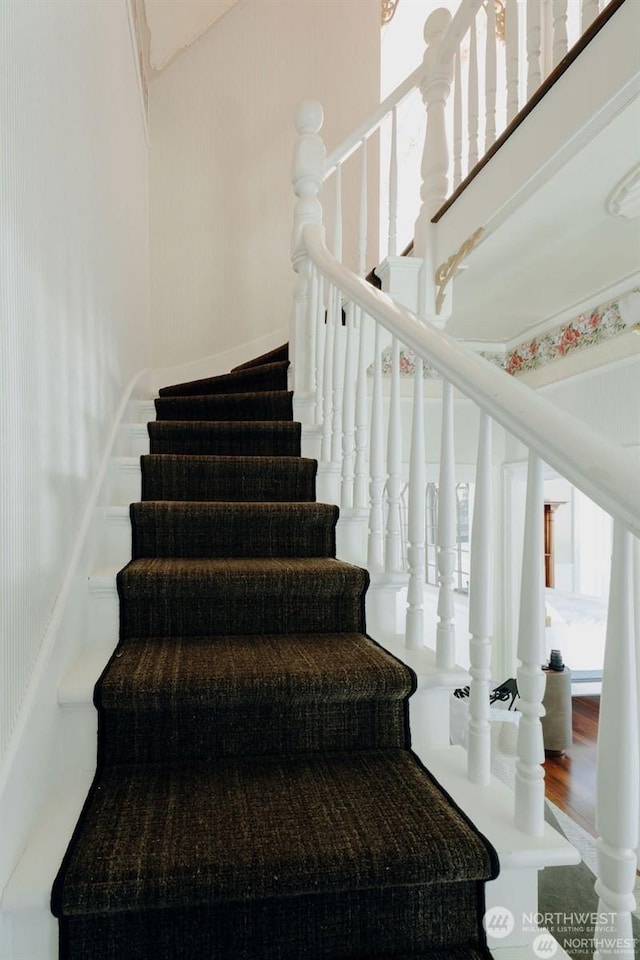 stairs with wood-type flooring