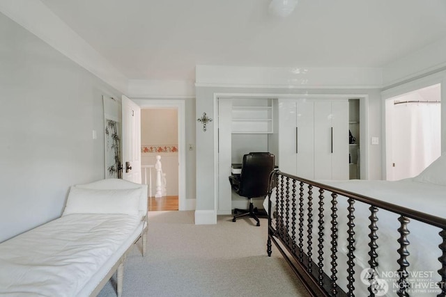 carpeted bedroom with a closet