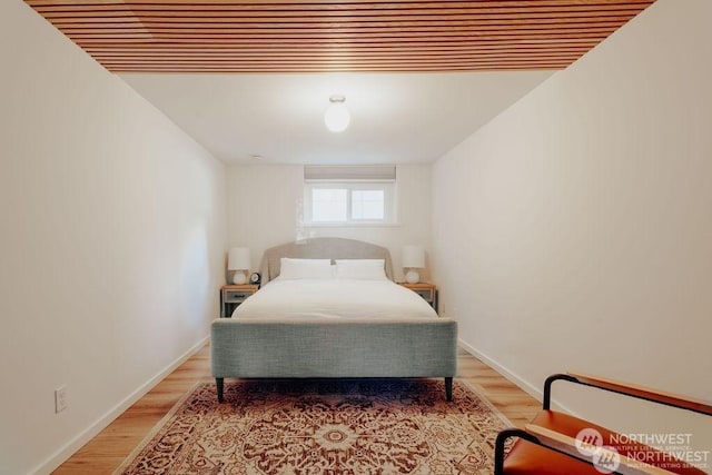 bedroom with hardwood / wood-style floors