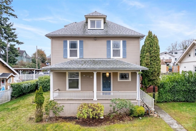 view of front of house featuring a porch and a front lawn