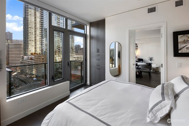 bedroom featuring dark hardwood / wood-style flooring