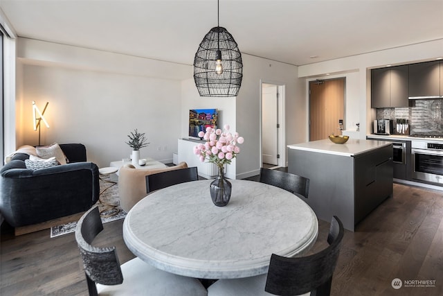 dining area featuring dark hardwood / wood-style flooring