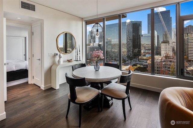 dining space with dark wood-type flooring