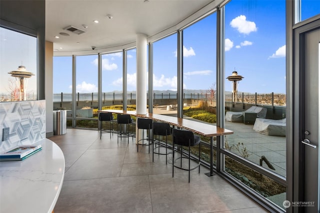 sunroom with plenty of natural light