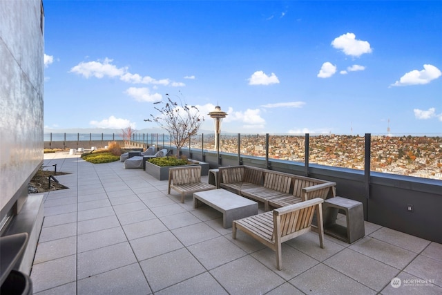 view of patio / terrace with outdoor lounge area and a water view