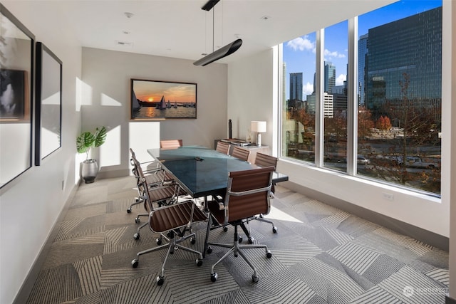 office area featuring light colored carpet