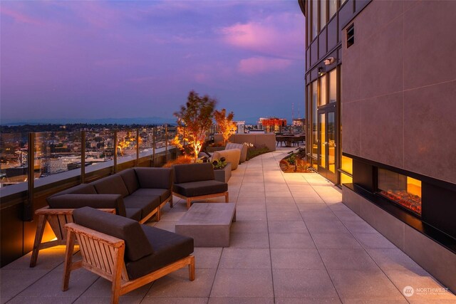 patio terrace at dusk with an outdoor hangout area