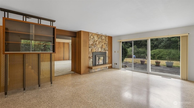 unfurnished living room featuring a fireplace