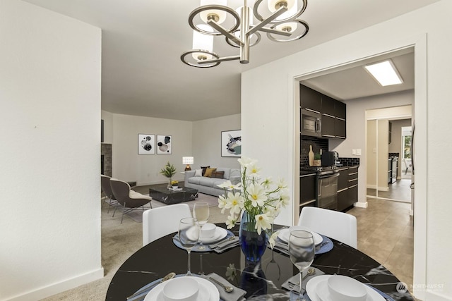 dining area featuring a notable chandelier