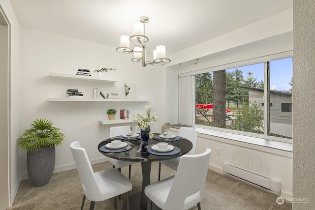 dining area featuring a baseboard radiator, carpet flooring, and a chandelier