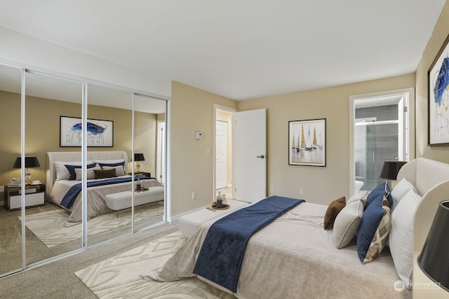 carpeted bedroom featuring ensuite bath and a closet