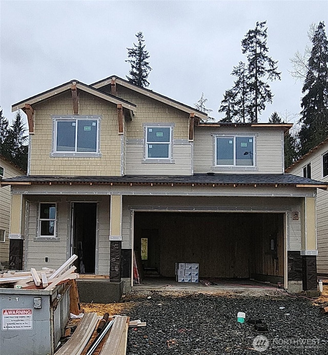 craftsman-style home featuring an attached garage and a porch