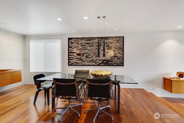 dining area featuring wood-type flooring