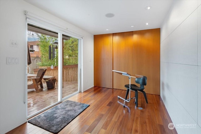 exercise room featuring hardwood / wood-style flooring