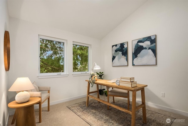 office area with carpet and vaulted ceiling