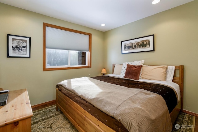 bedroom with dark wood-type flooring