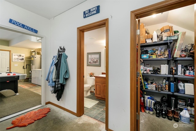 interior space with lofted ceiling and strapped water heater