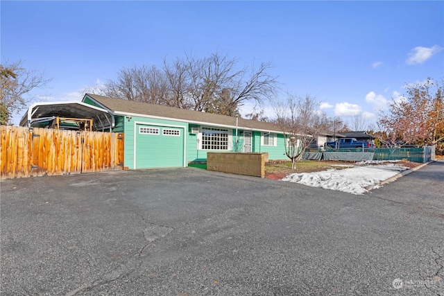 single story home featuring a garage