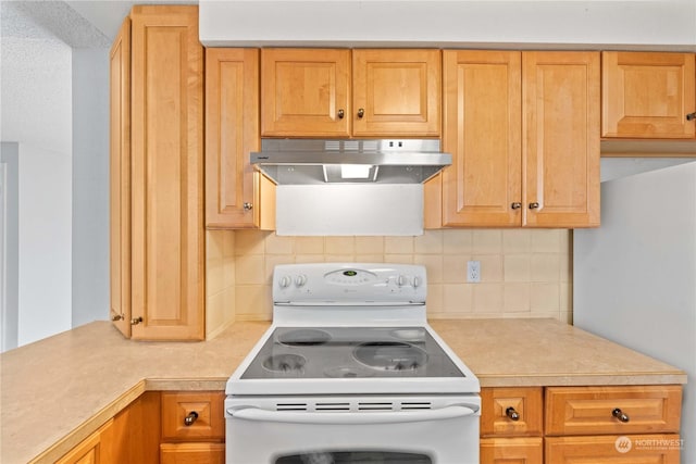 kitchen with decorative backsplash and white appliances