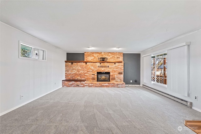 unfurnished living room with carpet flooring, ornamental molding, a fireplace, and a baseboard radiator