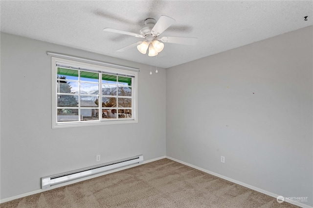 empty room featuring carpet, ceiling fan, a textured ceiling, and a baseboard heating unit